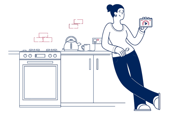 woman leaning on a kitchen worktop holding an energy smart meter