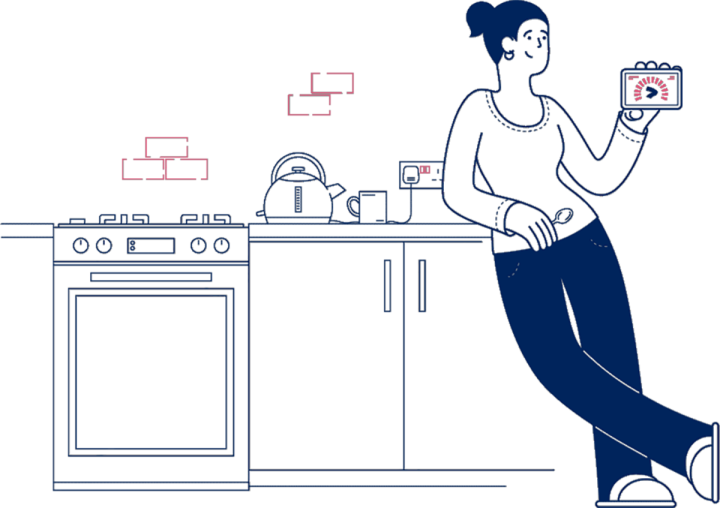 woman leaning on a kitchen worktop holding an energy smart meter