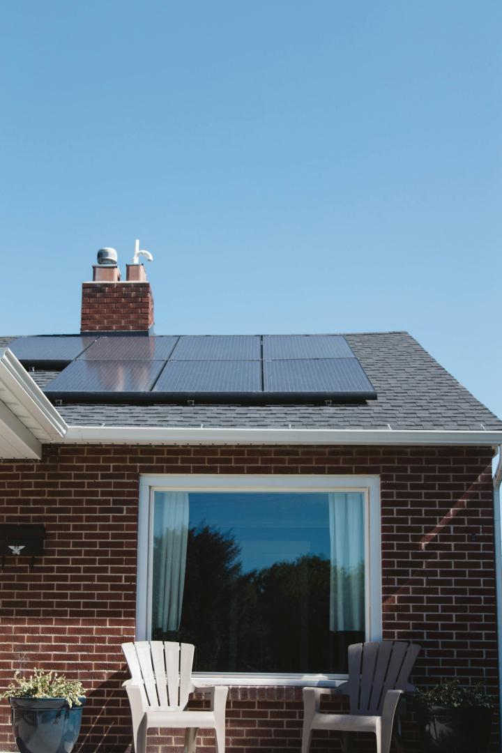 solar photovoltaic panels mounted on a tiled house roof