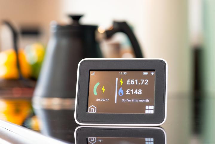 close-up of the screen of a smart home energy meter display in a kitchen