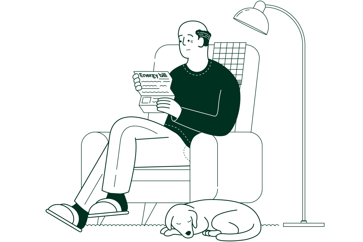 worried looking elderly man in an armchair reading a letter with a dog sleeping at his feet