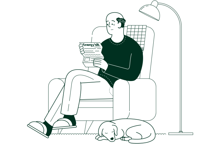 worried looking elderly man in an armchair reading a letter with a dog sleeping at his feet