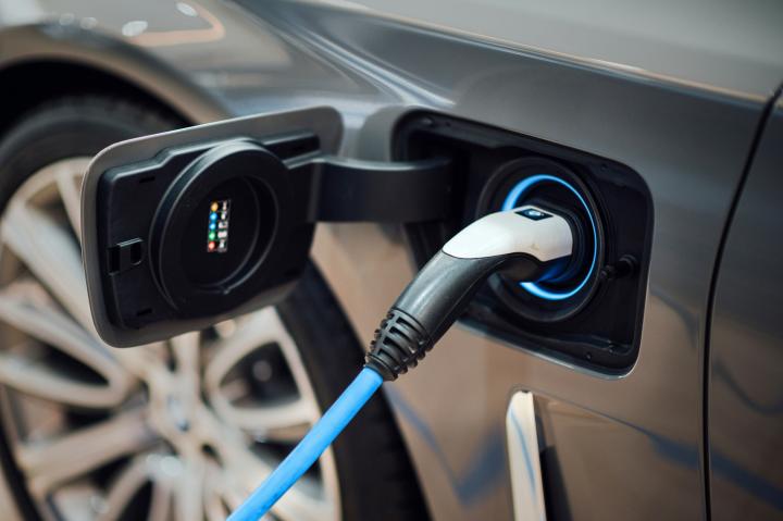electric car being charged via a charging cable